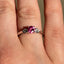 Round Brilliant Cut Pink Sapphire with Pear Cut Diamond Side Stones Trilogy Ring
