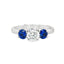 Round Brilliant Cut Diamond with Brilliant Round Cut Sapphire Side Stones Trilogy Ring