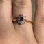 Oval Cut Ruby & Round Brilliant Cut Diamond Cluster Engagement Ring