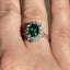 Oval Cut Emerald & Round Brilliant Cut Diamond Cluster Engagement Ring