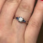 Round Brilliant Cut Diamond with Pear Cut Sapphire Side Stones Trilogy Ring