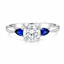 Round Brilliant Cut Diamond with Pear Cut Sapphire Side Stones Trilogy Ring