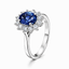 Oval Cut Sapphire With Round Brilliant Cut Diamond Cluster