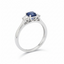 Emerald Cut Sapphire with Round Brilliant Cut Diamond Side Stones Trilogy Ring