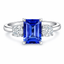 Emerald Cut Tanzanite With Round Brilliant Cut Diamond Side Stones