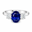 Oval Cut Sapphire with Round Brilliant Cut Diamond Side Stones Trilogy Ring