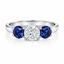Round Brilliant Cut Diamond with Brilliant Round Cut Sapphire Side Stones Trilogy Ring