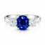 Cushion Cut Sapphire with Round Brilliant Cut Diamond Side Stones Trilogy Ring